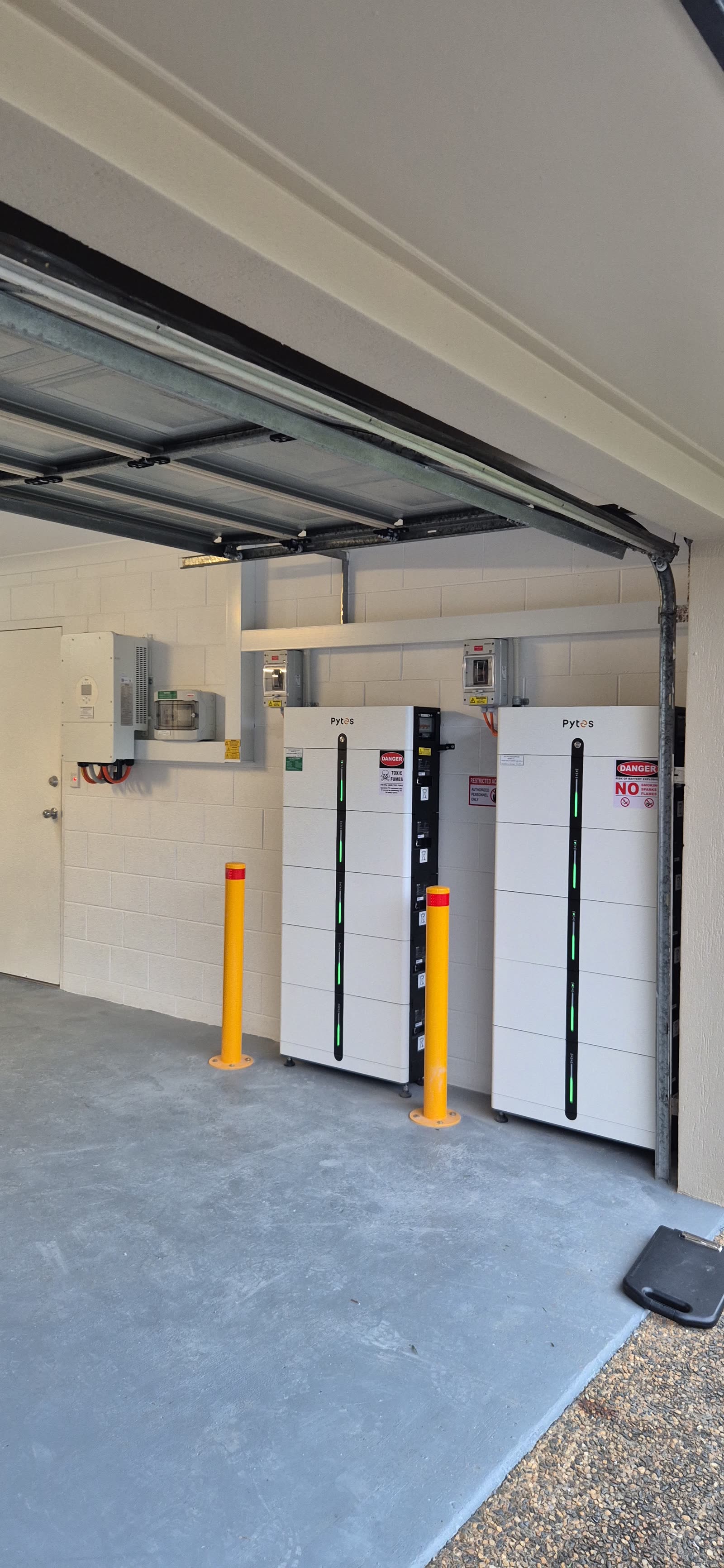Pytes Pi LV1 stack and Deye inverter neatly installed on a white garage wall
