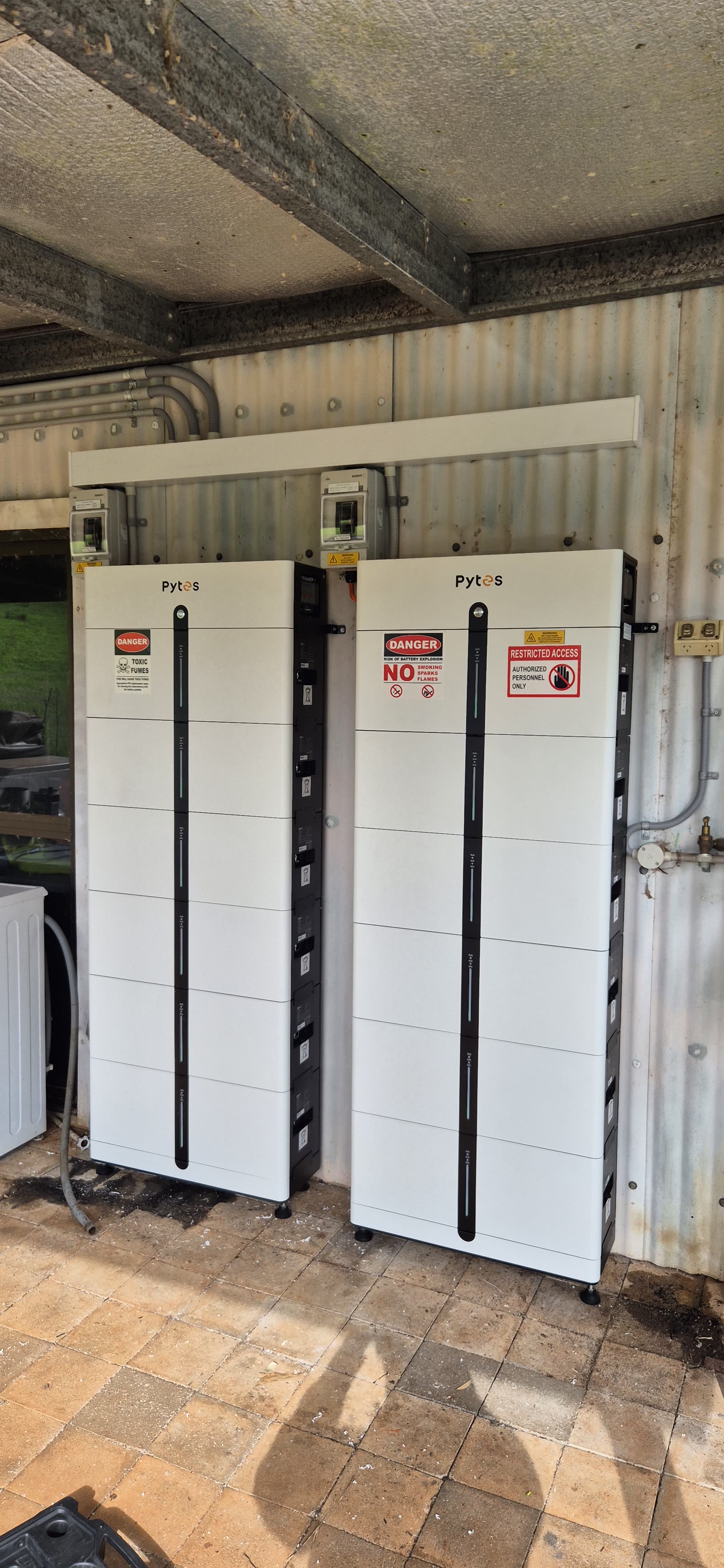Pytes Pi LV1 batteries with bollard protection inside a residential garage